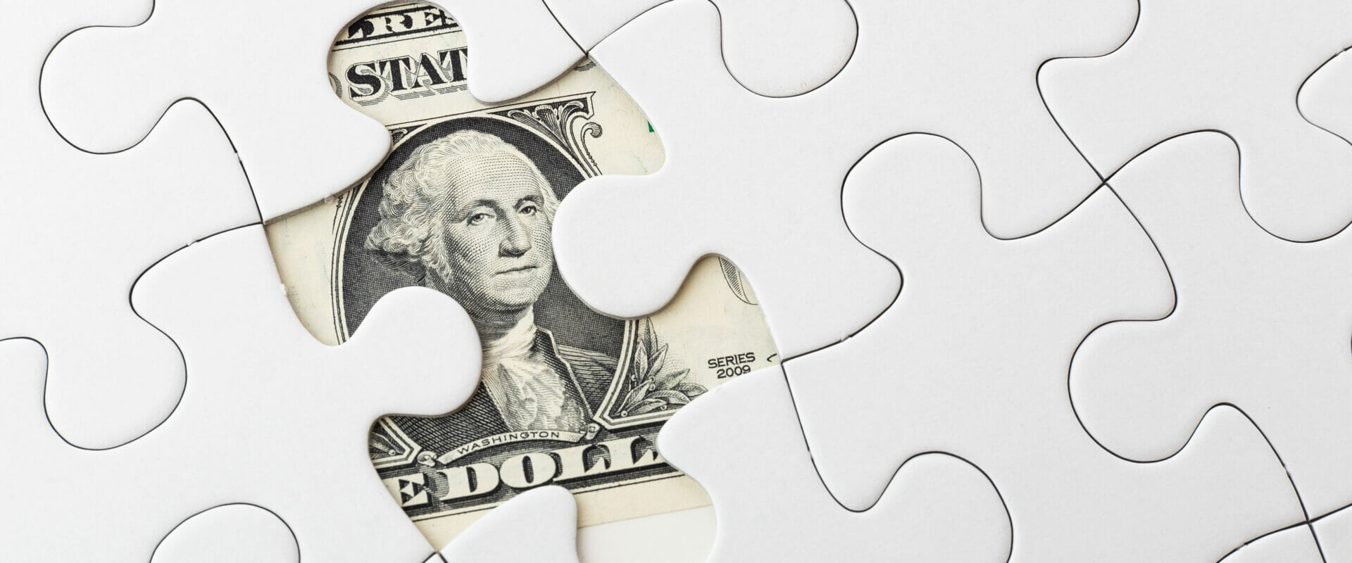 a puzzle with a misisng piece revealing a dollar as a symbol of business impact analysis