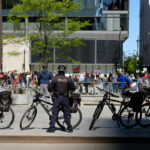 police prepare for election day civil unrest as a political protest moves through a downtown area during a moment of civil unres