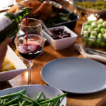 Family and friends enjoying a carefree holiday meal because they know to destress during the holidays