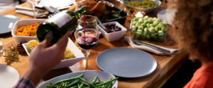 Family and friends enjoying a carefree holiday meal because they know to destress during the holidays