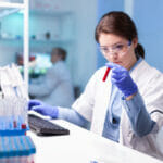 How to Secure Intellectual Property - featuring a picture of a woman scientist in a lab