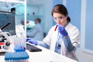 How to Secure Intellectual Property - featuring a picture of a woman scientist in a lab