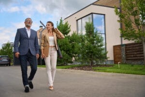 a consultant and an executive walking the property discussing Residential Security