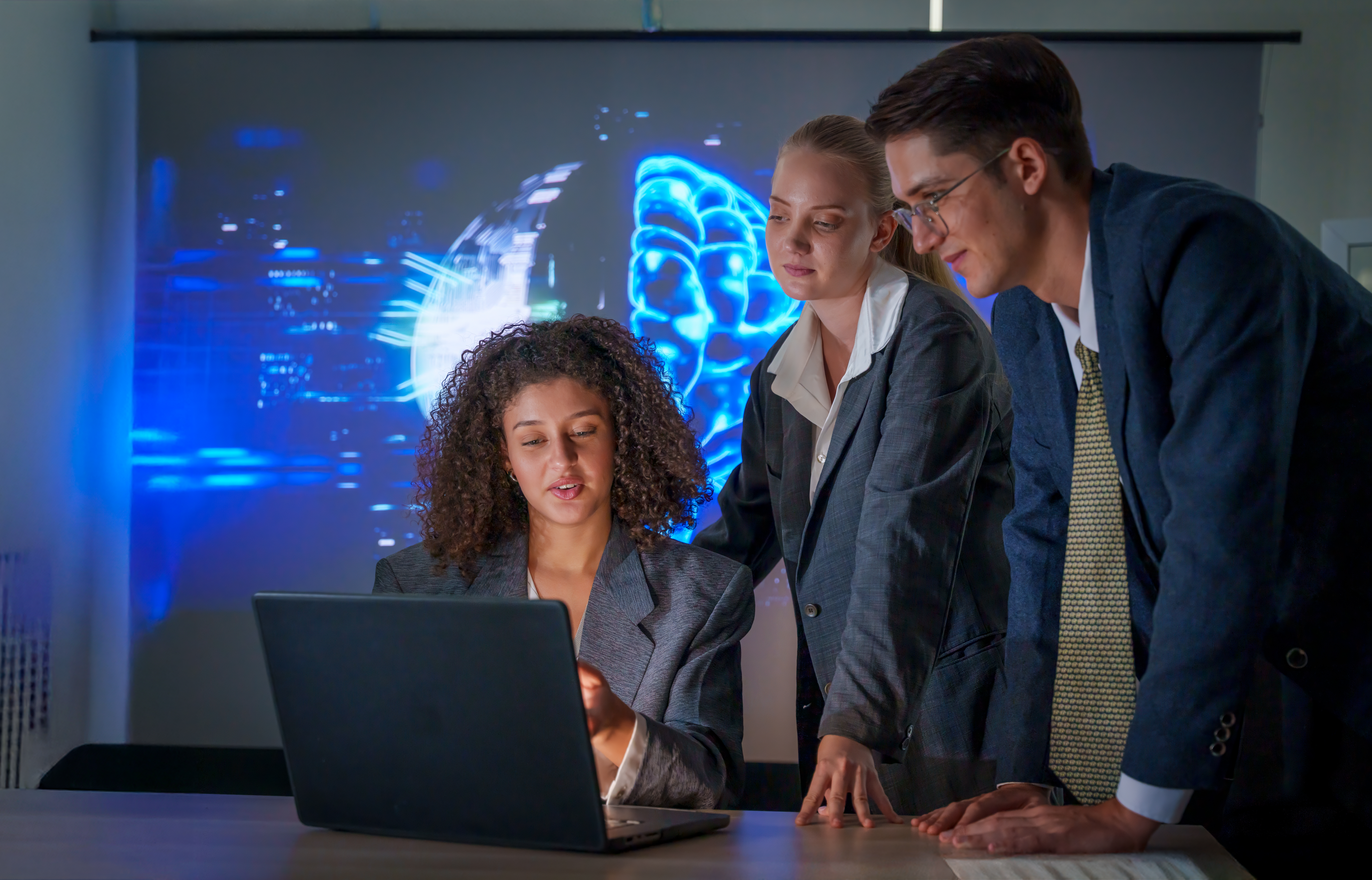 Executives analyzing real-time threat intelligence and risk insights using Chesley Brown’s ATMOS security analytics platform